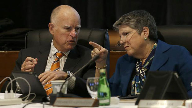 Gov. Jerry Brown talks with University of California president Janet Napolitano during a UC Board of Regents meeting in San Francisco on March 18. (Jeff Chiu / Associated Press)