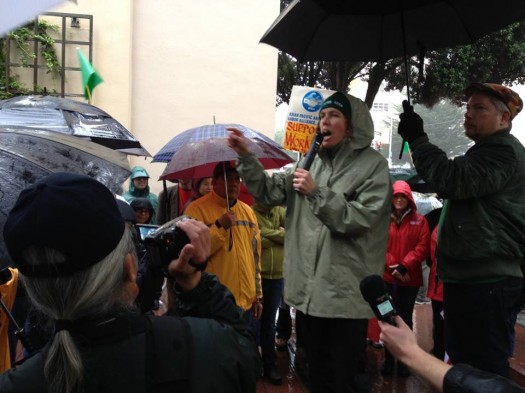 Kathryn Lybarger, with microphone, at U.C. San Francisco Medical Center.  Photo credit: FryingPanNews.org