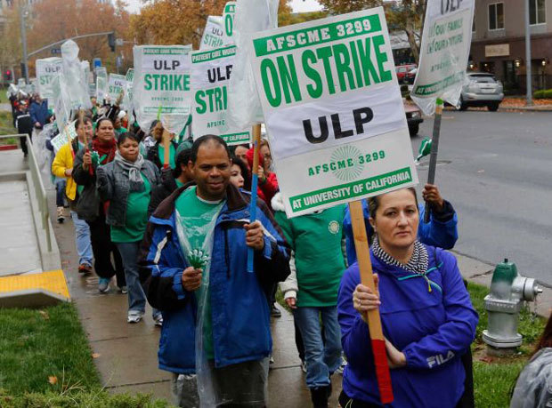 Employees of the University of California, Davis Medical Center and supporters marched in front of the medical center during a one-day strike in Sacramento, Calif., Wednesday, Nov. 20, 2013. UC hospital employees picketed medical centers across the state in response to what union leaders called intimidation and harassment from management against workers who took part in a two-day walkout in May. The May strike came after the union's contract expired and negotiations over a new deal failed. Photo: Rich Pedroncelli, AP