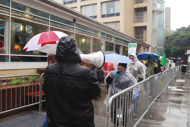 UCSF workers brave the rain during a strike Wednesday in front of the Parnassus campus. - EVAN DUCHARME/SPECIAL TO THE S.F. EXAMINER