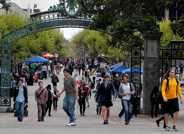 Brant Ward / The Chronicle Students walk through Sather Gate at UC Berkeley.