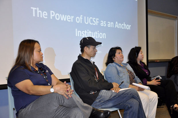 Representatives of the UCSF staff and contracted custodial employees speak at a union-backed meeting