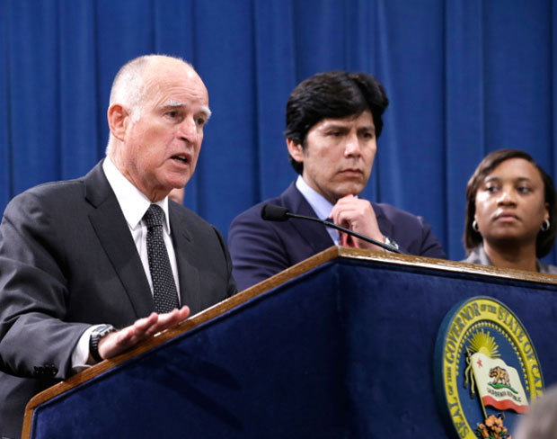 Accompanied by labor leaders and Senate President Pro Tem Kevin de Leon, D-Los Angeles, California Gov. Jerry Brown discusses proposed legislation to increase the state's minimum wage to $15 per hour by 2022, during a news conference in Sacramento, Calif. on March 28, 2016. If approved by the Legislature, California would be the first state to raise the minimum wage to $15. AP Photo/Rich Pedroncelli