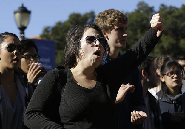 A woman signals with a thumbs down at a protest against tuition increases at the University of California Berkeley in Berkeley, Nov. 24, 2014. Jeff Chiu AP
