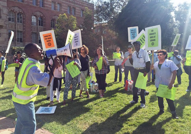  UCLA dining hall workers protested Thursday near the flagpole and outside Covel Commons asking for better wages and more transparency from UCLA when hiring new staff. (Daniel Alcazar/Daily Bruin senior staff) 
