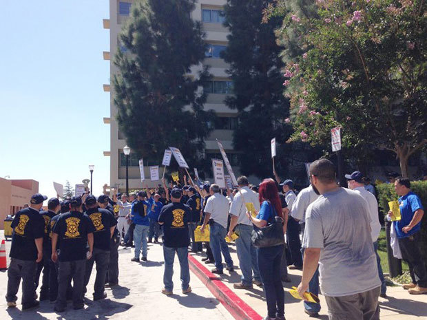 Members of Teamsters Local 2010, the union representing UCLA skilled trades workers, protested what they called a low wage proposal during Friday move-in. (Ryan Leou/National and higher education editor) 